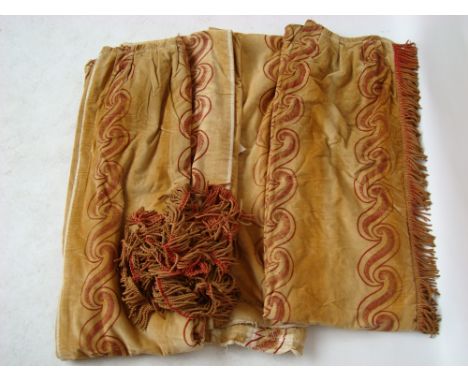 Two pairs of full length Arts and Crafts cream velvet curtains with red stencilled interlocking scroll design  and bullion fr