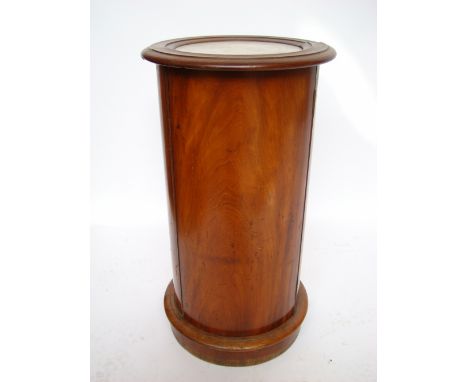 A Victorian mahogany cylinder bedside cupboard, the circular moulded top inset with marble above a hinged door enclosing a si