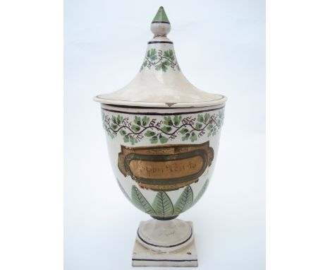 A late 18th Century Doccia Ginori faience glazed pottery vase and cover, of urn form on circular pedestal foot and square bas