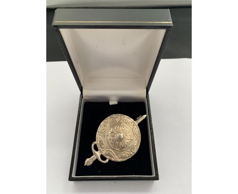A SILVER CELTIC BROOCH 