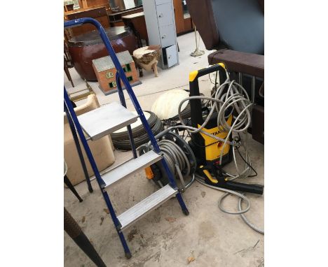 A STANLEY PRESSURE WASHER WITH HOSE REEL AND A TWO RUNG BELDRAY STEP LADDER 