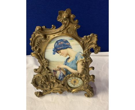 A BRASS ART NOUVEAU MANTLE CLOCK 