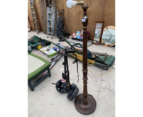 A WOODEN STANDARD LAMP BASE TOGETHER WITH GOLF BAG CADDY - IN W/O 