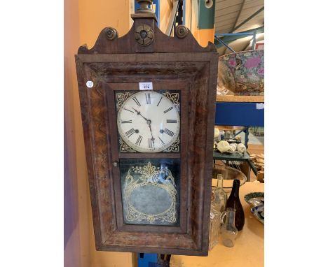 AN ORNATE VINTAGE WOODEN WALL CLOCK WITH GOLD DETAIL 