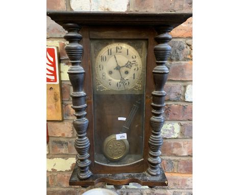 A VINTAGE ORNATE WOODEN WALL CLOCK 