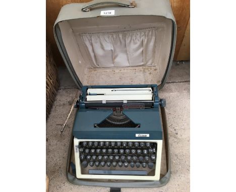 A VINTAGE ERIKA TYPEWRITER COMPLETE WITH ORIGINAL CASE 