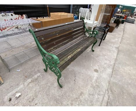 A VINTAGE GARDEN BENCH WITH CAST IRON ENDS 