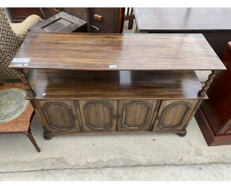 A JACOBEAN STYLE BUFFET TABLE ON BARLEYTWIST SUPPORTS, ENCLOSING CUPBOARDS TO THE BASE 