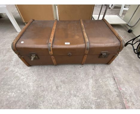 A WOOD BOUND TRAVEL TRUNK 