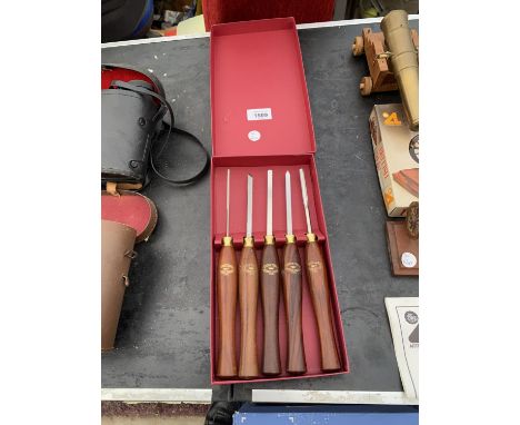 A SET OF FIVE CROWN TOOLS MINIATURE WOOD CHISELS 