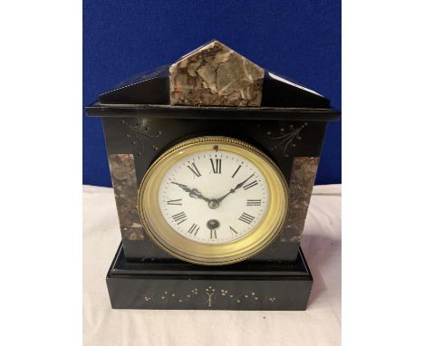 A POLISHED SLATE AND MARBLE VICTORIAN MANTLE CLOCK WITH BRASS DETAIL AND KEY 