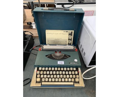 AN IMPERIAL 220 TYPEWRITER TO INCLUDE THE CASE 