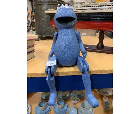 A MOVEABLE WOODEN SESAME STREET 'COOKIE' SHELF PUPPET 