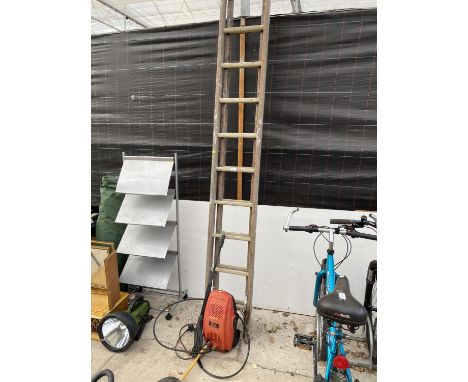 A POWER DEVIL PRESSURE WASHER AND A WOODEN EXTENDING LADDER WITH METAL RUNGS 