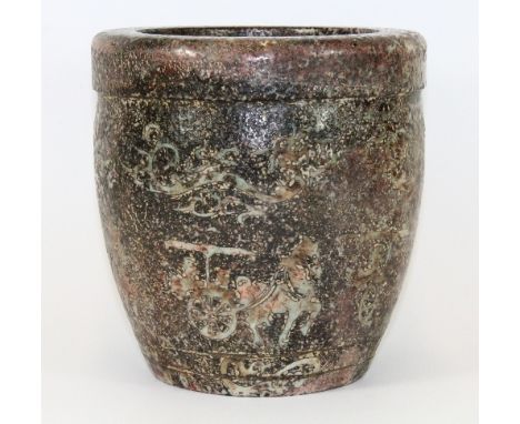 A carved mixed colour jade brush pot decorated with scenes of chariots and dragons H 21cm Dia 20cm
