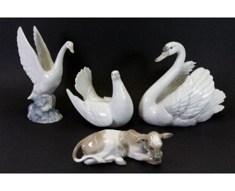 Lladro swan, dove and cow figures and a Nao goose.