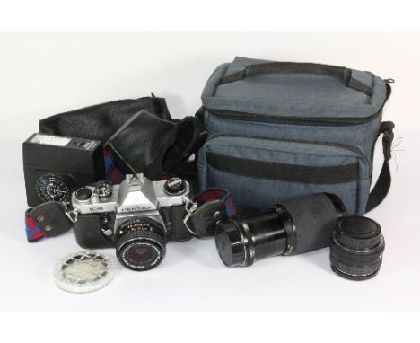 An Asahi Pentax single lens reflex camera with a Pentax 1:3.5 28mm lens, a Pentax 1:1.8 /55 lens and an Optomax 1:4.5 80-200m