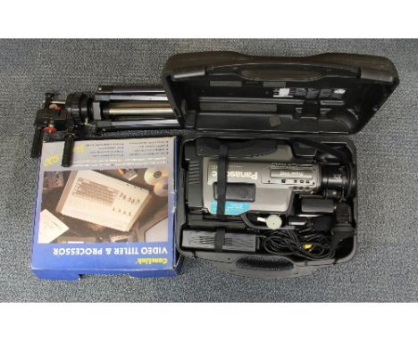 A cased professional Panasonic video camera, editor and tripod