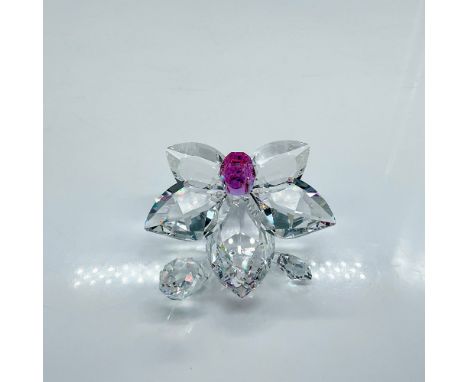 Clear faceted crystal figure of an orchid with a bright purple Fuchsia Rain crystal pistil. Signed by artist. Swarovski mark.