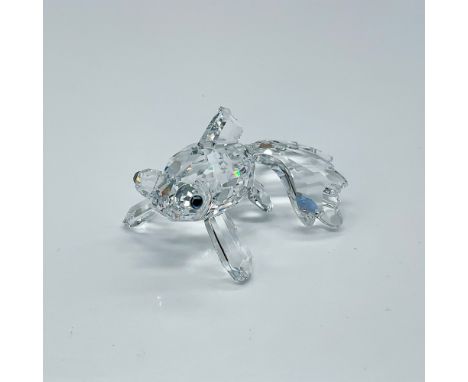 Depicts a clear crystal telescope fish standing on its fins with teal-colored eyes. This item has its original box which meas