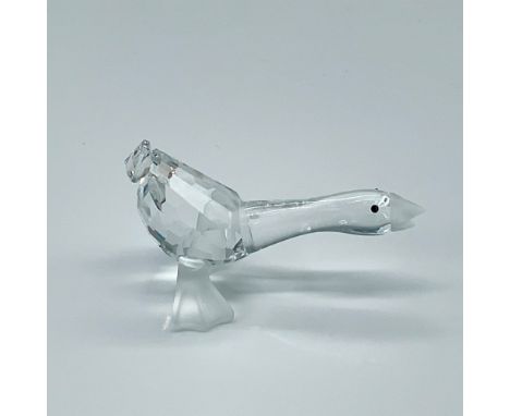 A clear faceted goose with black eyes. Frosted beak and feet. Swarovski etched backstamp. This item has its original box whic