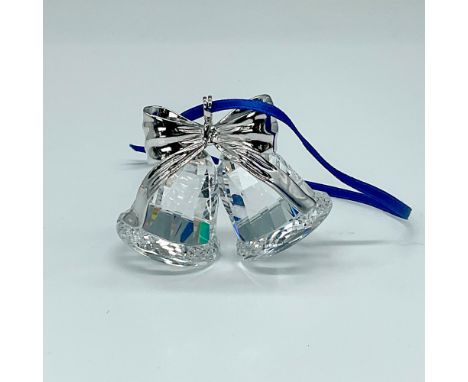 Gleaming crystal-clear bells adorned with a rhodium bow and hanger. Swarovski backstamp. This item has its original box which