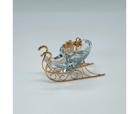 This elegant sleigh sparkles with clear crystal and features charming gold accents on the runners and base. Item number 84276