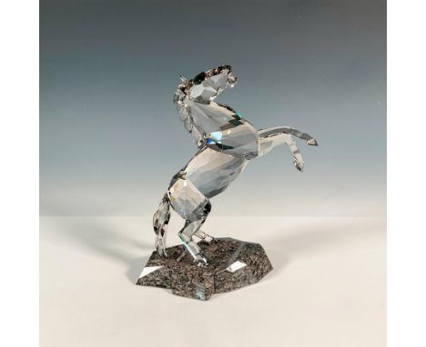 Dynamic and expressive stallion capturing the beauty and power of a horse in motion. This piece shines in a crystal satin and