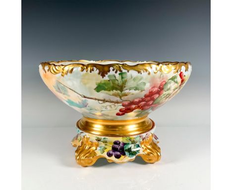 Lovely hand painted gilded bowl decorated with grapes and vines colored in soft colors. Base of bowl has a gilded band. T&amp