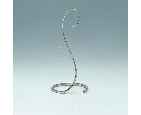 This elegant silver-tone metal display features a stylish clear crystal accent, offering timeless sophistication for year-rou