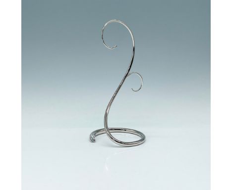 This elegant silver-tone metal display features a stylish clear crystal accent, offering timeless sophistication for year-rou
