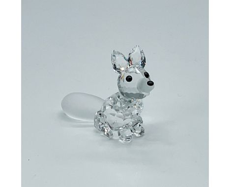 An adorable, seated fox with a frosted tail, nose, and front paws. Black crystals for the eyes and nose. Swarovski backstamp.