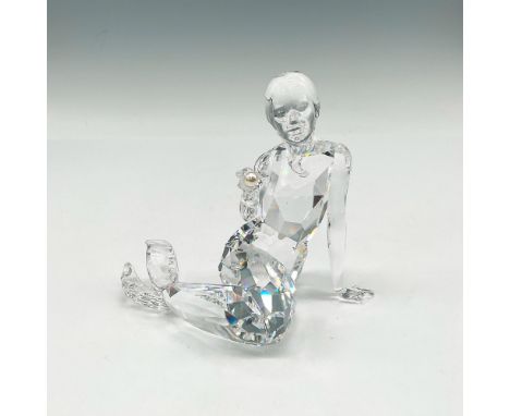 Part of the Fables and Tales group. Figural is made of clear crystal with facets to catch the light sitting she holds a pearl
