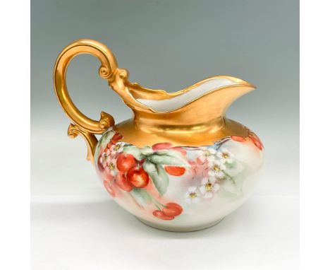 Hand-painted pitcher decorated with red cherries and white flowers; gold handle, rim and top section. Signed Maus. T+V backst