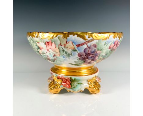 Lovely hand painted design of grapes, leaves and branches with gilt accent on rim and base. This item has a porcelain hand pa