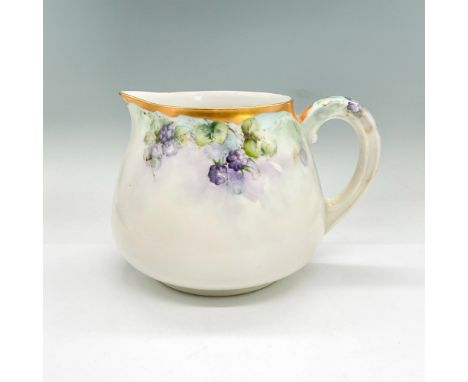 Hand-painted pitcher decorated with purple blackberries and gold rim. T+V backstamp. Dimensions: 8.5"L x 6.25"W x 6"HManufact