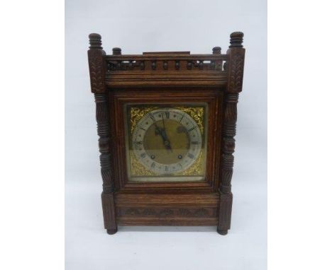 An Edwardian oak cased mantle clock. 