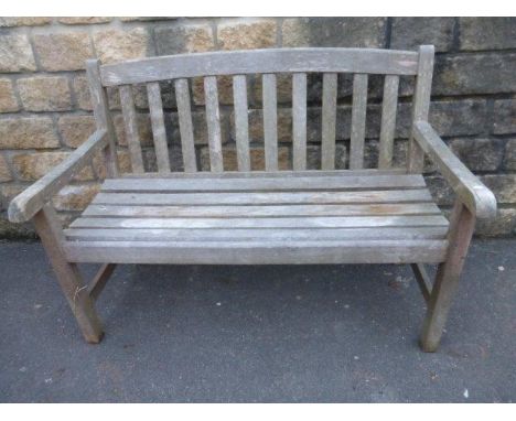 A well weathered garden bench.