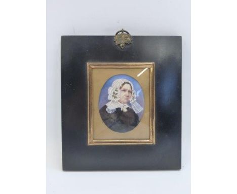 A 19th Century portrait miniature of a Victorian lady, probably on ivory, within an ebonised frame.