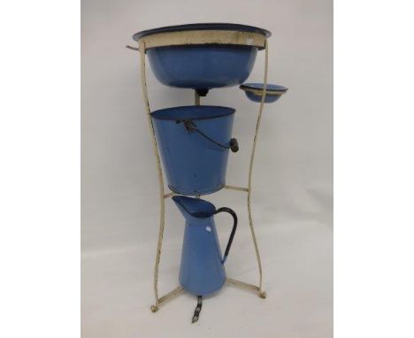 Yesterday's World Museum Scullery - A blue enamel jug and bowl set with matching slop pail on a metal stand.