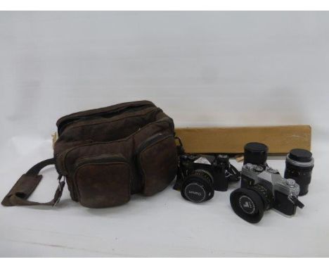 A camera bag containing a Canon camera, tripod, etc.