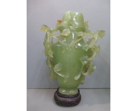 A large carved jade vase. 