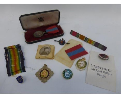 A cased Faithful Service medal awarded to Charles Edward Pickett with spare ribbon and associated black and white photograph;