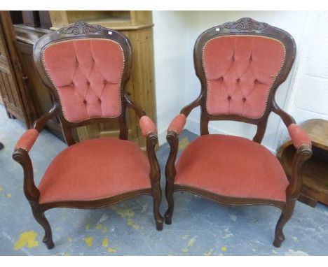 A pair of contemporary mahogany framed button back elbow chairs. 