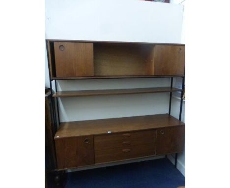 A Danish style wall unit suspended on metal bars comprising a shelf, a unit with open central shelf flanked by two cupboards 