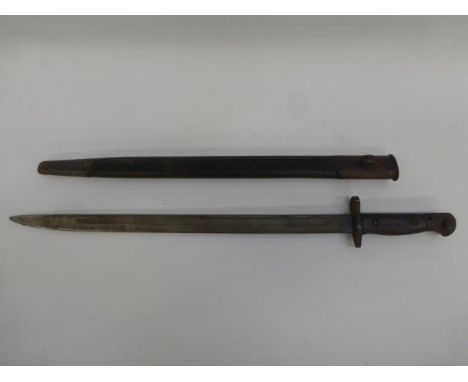 An early 20th Century bayonet with leather scabbard, stamped GR 1907.