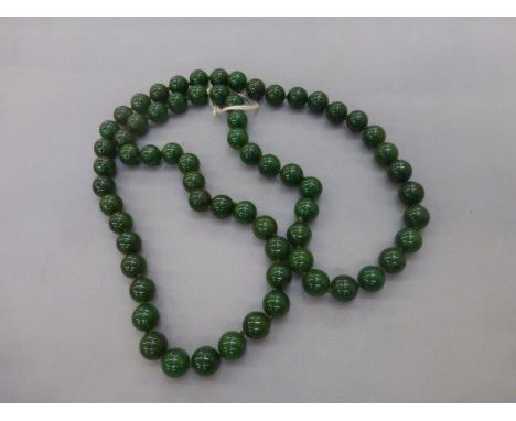 A jade beaded necklace.