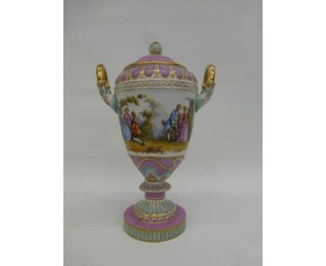 A Dresden twin handled lidded pedestal vase decorated with classical scenes. 