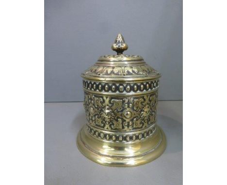 An embossed brass lidded tobacco jar, maker Adolf Frankau. 