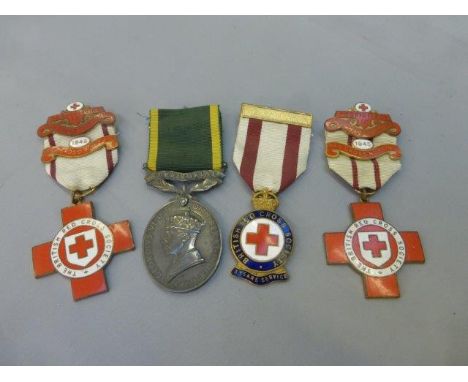 A Territorial Army Efficiency medal awarded to Sgt. C.A. Burton REME no. 7602431, two British Red Cross Society enamel nursin